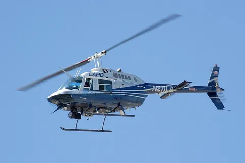 helicopter: an aircraft that is borne along by one or more sets of long rotating blades which allow it to...