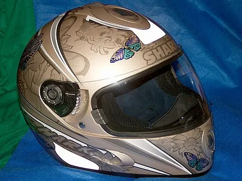 helmet: a hard, protective head covering, typically part of armour