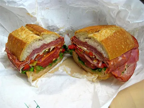hero sandwich: a large sandwich on a long thick bun