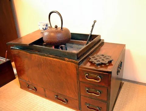 hibachi: a portable brazier, powered by charcoal, used for cooking