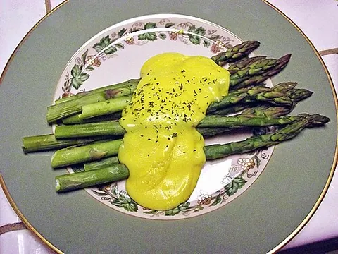 hollandaise sauce: an emulsion of butter and lemon juice using egg yolks as the emulsifying agent, used in French...