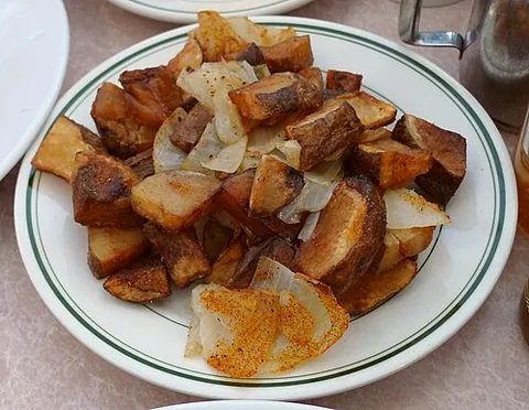 home fry: a piece of fried, sliced or diced potato, part of a basic potato dish often including tomatoes,...