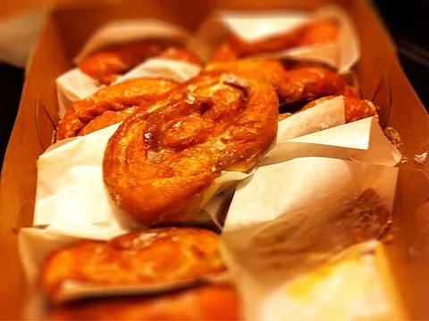honey bun: a glazed fried yeast pastry with honey and cinnamon in the dough