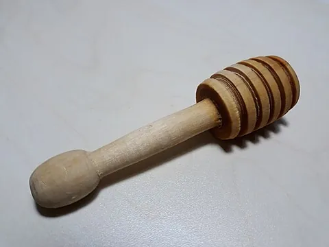 honey dipper: a turned kitchen tool used to transfer honey