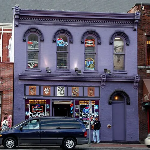 honky-tonk: a bar or nightclub that caters to Southern patrons and provides country music for entertainment