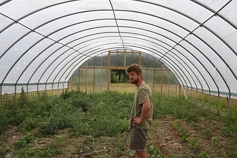 hoop house: a hoop-framed building, consisting of a line of hoops braced to each other, attached to ground...