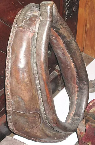 horse collar: a part of a horse's harness that is used to distribute the load around its neck and shoulders when...