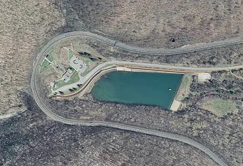 horseshoe curve: a curve in the shape of a horseshoe, often on a railway, where hairpin bends cannot be used