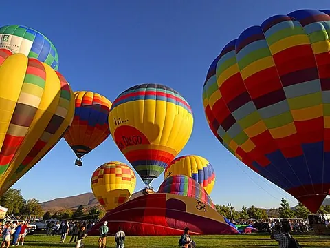 hot-air balloon: a balloon-shaped aircraft whose bag is inflated with hot air, carrying passengers and crew in a...
