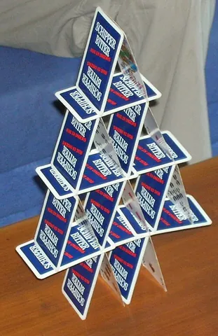 house of cards: a structure made by stacking playing cards in a pyramidal fashion