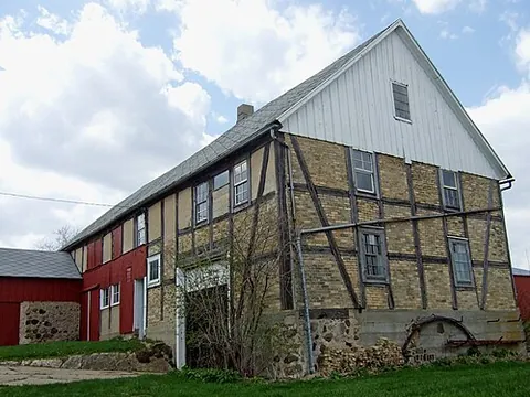 housebarn: a building that is a combination of a house and a barn