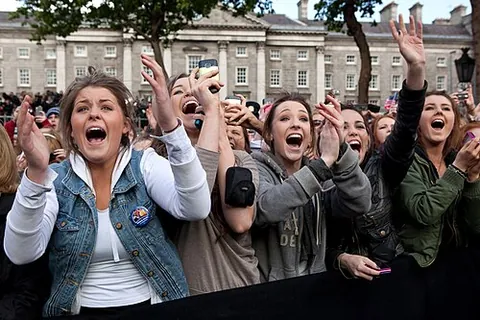 hubbub: a confused sound of a crowd of people shouting or speaking simultaneously; an uproar