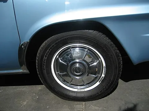 hubcap: a decorative and protective disk that covers the hub of a motor car wheel