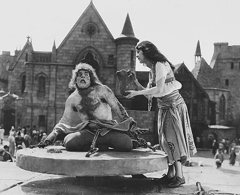 hunchback: one who is stooped or hunched over