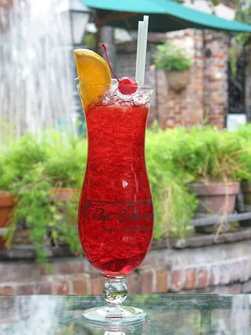 hurricane glass: a tall, curvy glass, similar to a tulip glass, used to serve certain alcoholic drinks