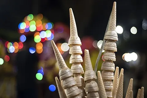 ice cream cone: an edible holder, usually sweet and usually a baked good, for ice cream
