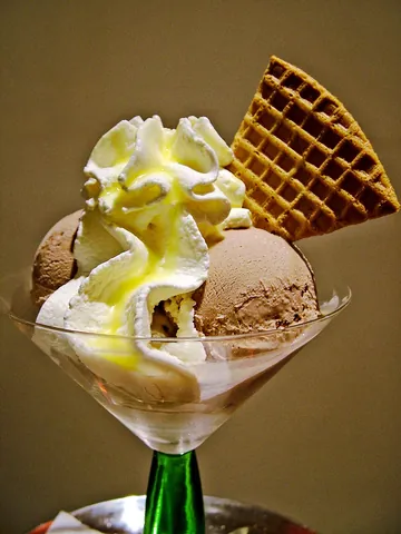 ice cream: a dessert made from frozen sweetened cream or a similar substance, usually flavoured