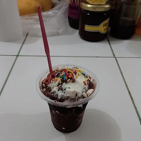 ice scramble: ice scramble (Filipino shaved ice dessert with banana extract, sugar, evaporated milk or condensed...