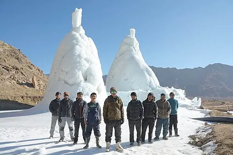 ice stupa: a rough cone of ice created by spraying piped water into the air in freezing conditions, used to...