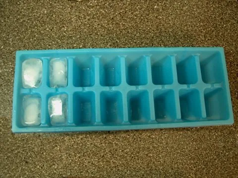 ice tray: a household item with a series of indentations to be filled with water (or another liquid) and...