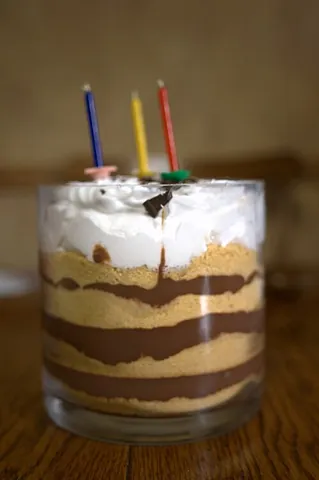 icebox cake: a dessert consisting of whipped cream and stacked chocolate wafers, refrigerated to form a...