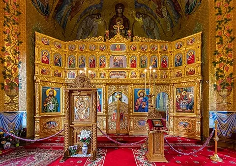 iconostasis: a wall of icons between the sanctuary and the nave in an Eastern Orthodox church