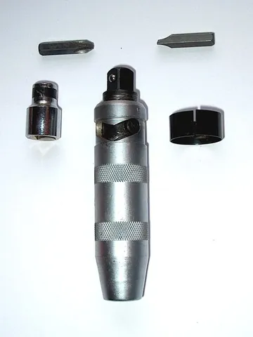 impact driver: a drill for making holes in order to later use another drill to place screws in