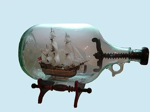 in: contained by; inside