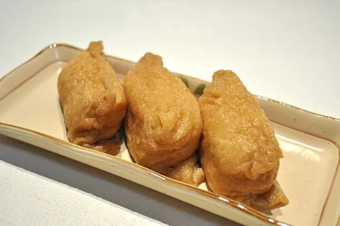 inari: a type of sushi with rice wrapped in a pouch of fried tofu (aburaage)