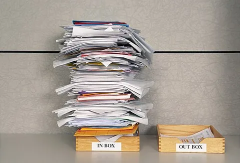 inbox: a container in which papers to be dealt with are put
