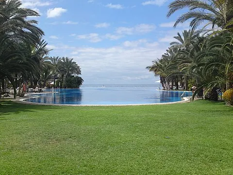infinity-edge pool: a swimming pool that produces a visual effect of water extending to the horizon or vanishing into a...