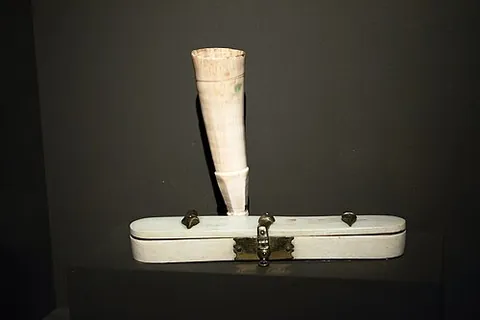 inkhorn: a small portable container, often made of horn, used to carry ink