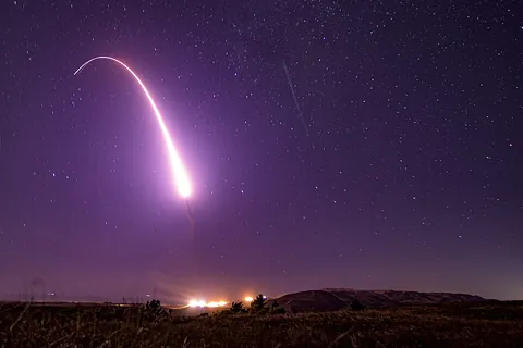 intercontinental ballistic missile: a class of long-range missiles associated especially with carrying nuclear warheads