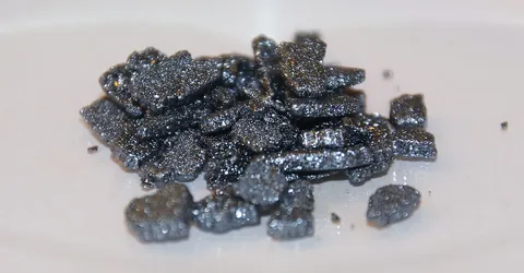 iodine: a chemical element (symbol: I) with an atomic number of 53; one of the halogens