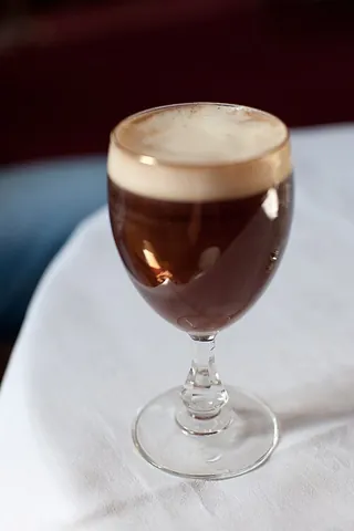 irish coffee: a cocktail consisting of hot coffee with a dash of Irish whiskey, topped with whipped cream