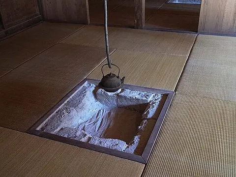 irori: a traditional sunken hearth common in Japan, used to heat the home and to cook food