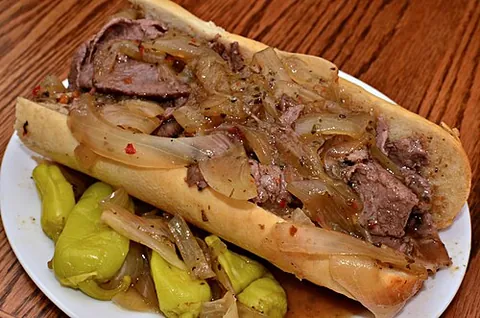 italian beef: a sandwich of thin slices of seasoned roast beef on a dense, long Italian-style roll