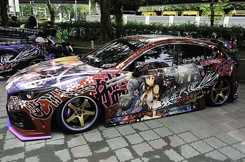 itasha: a car decorated with anime or manga artwork, including custom decals, dashboard ornaments, and...