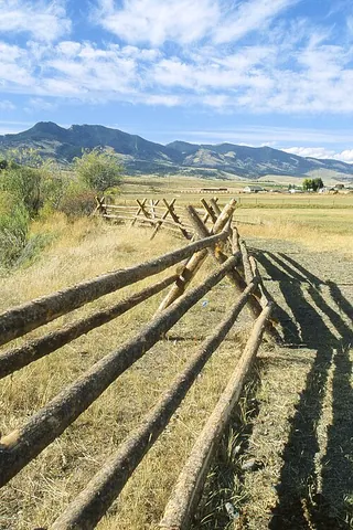 jackleg fence: a fence constructed with wooden posts attached to form Xs and a top rail resting where they cross,...