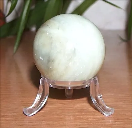 jade: a semiprecious stone, either nephrite or jadeite, generally green or white in color, often used for...