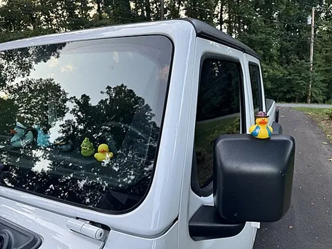 jeep ducking: the act of placing a small rubber duck on the dashboard of a Jeep