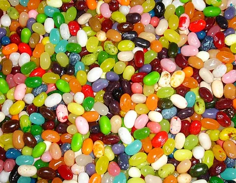 jelly bean: a small, bean-shaped, chewy candy/sweet with a firm coating and a jelly-like center, made of sugar,...