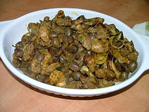 jerusalem mixed grill: a grilled meat dish consisting of chicken hearts, spleens, and liver mixed with pieces of lamb and...