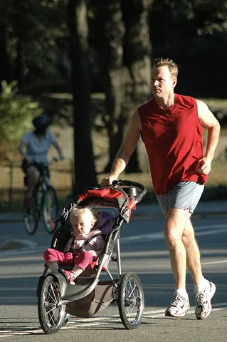 jogging stroller: a stroller that is designed for jogging or running, usually with three large inflatable wheels,...