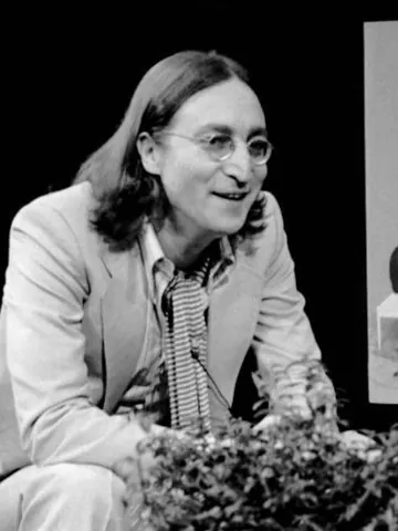 john lennon glasses: a pair of eyeglasses (spectacles) with round lenses
