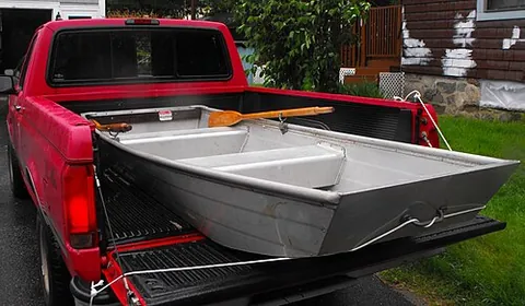 johnboat: a flat-bottomed boat with a very shallow draft, whose bow and stern are both squared off