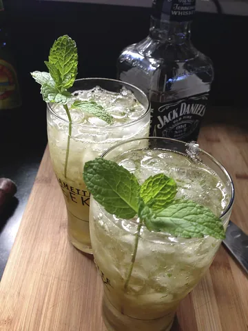 julep: a refreshing drink flavored with aromatic herbs, especially mint, and sometimes alcohol
