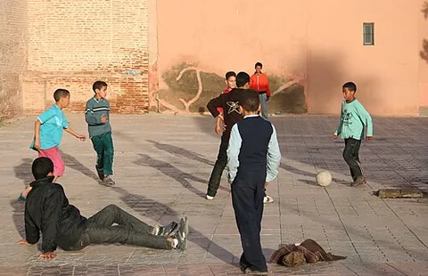 jumpers for goalposts: informal association football as played by children, especially as a romantic or old-fashioned...