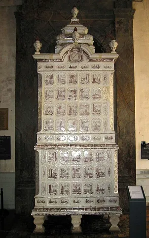 kachelofen: a German type of ceramic tile stove or cocklestove which captures heat from periodic burning of...