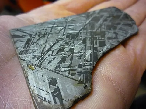kamacite: a meteoritic mineral which consists chiefly of iron and nickel